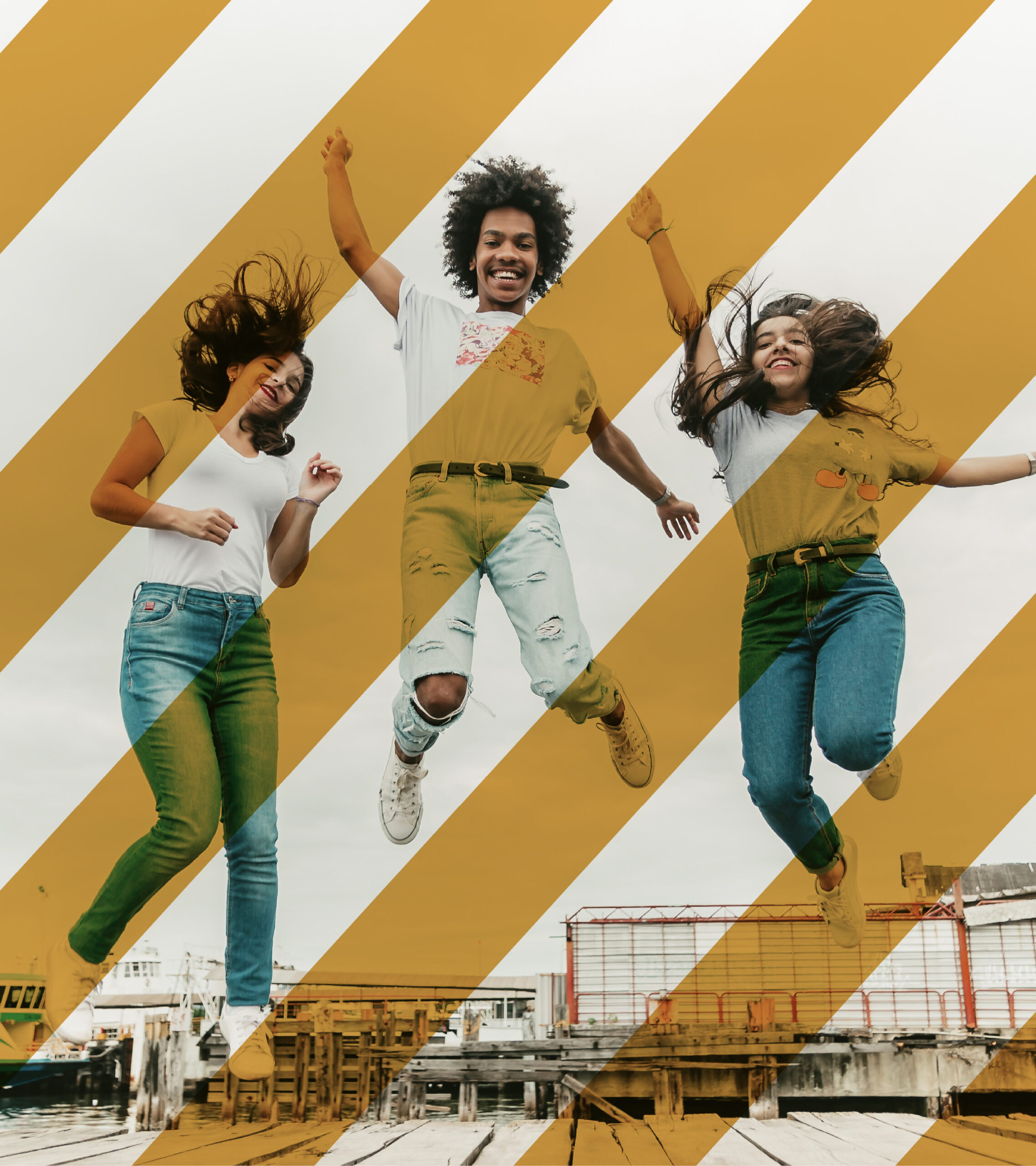 3 people jumping in mid-air with their hands up, smiling. There are thick diagonal lines across the image that are overlayed, adding a bright pop of color and energy.
