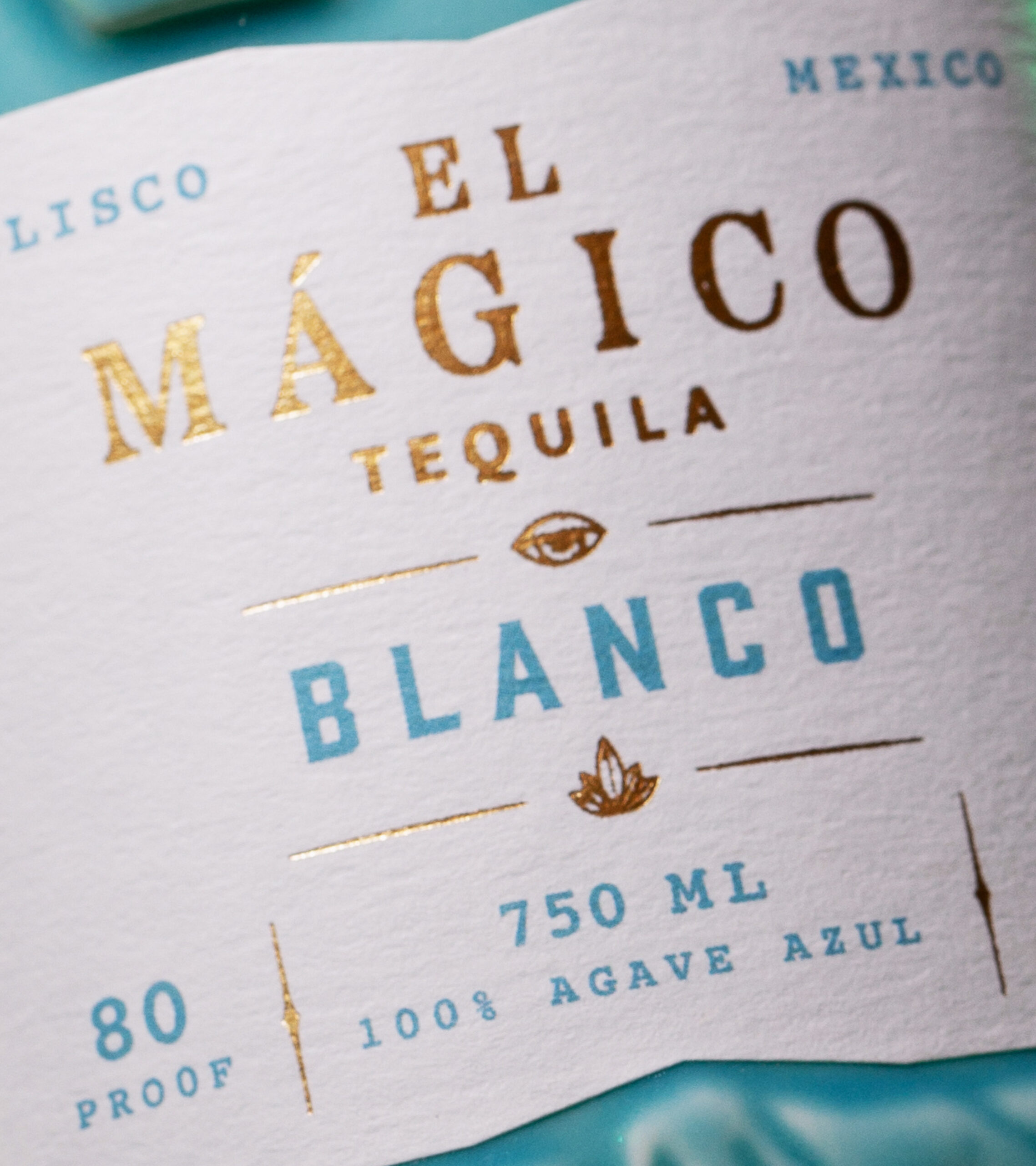 Close up shot of El Mágico Tequila Blanco flavor bottle label.