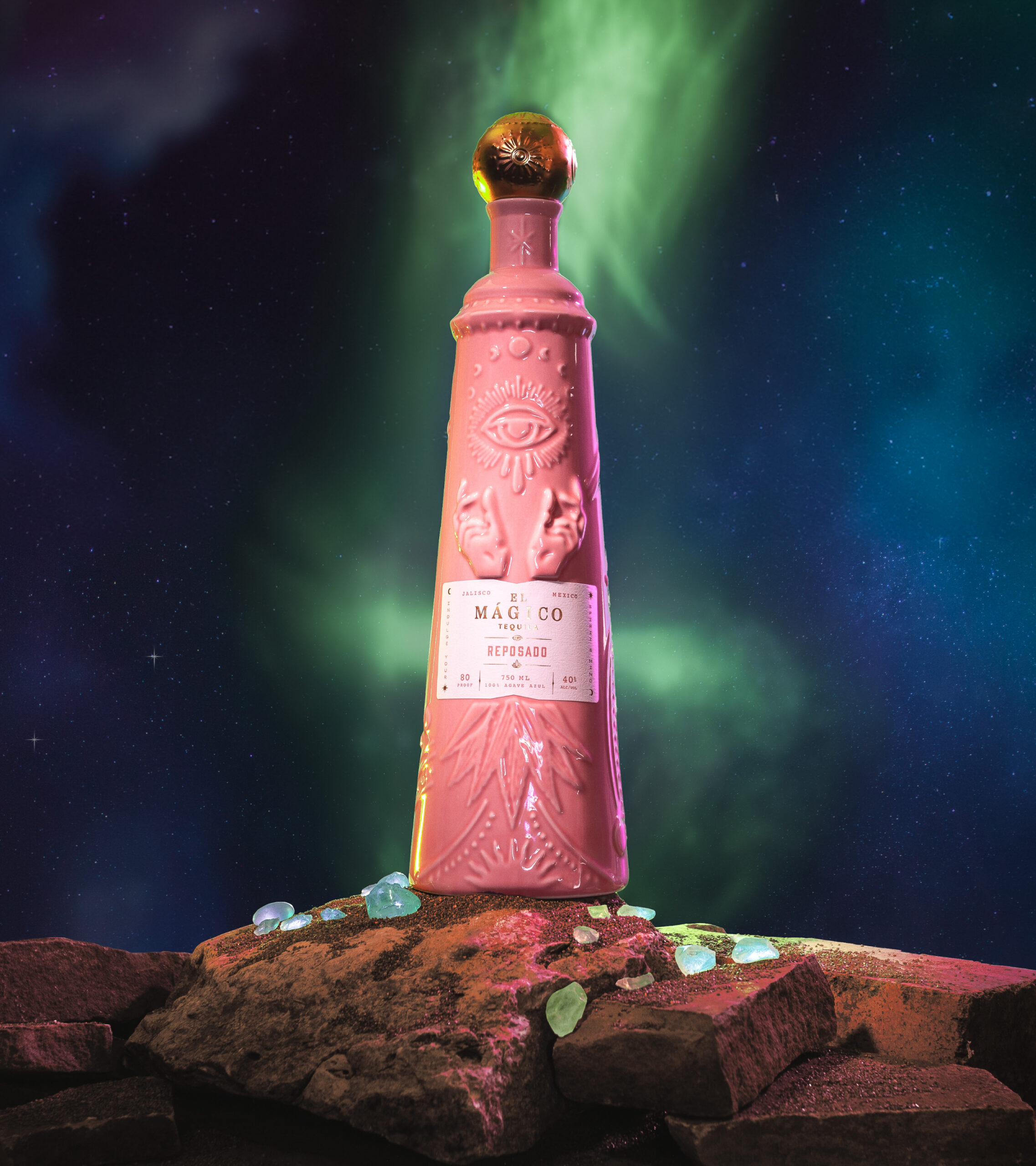 El Mágico Tequila Reposado flavor bottle on top of a rock with crystals, with a mystical background.
