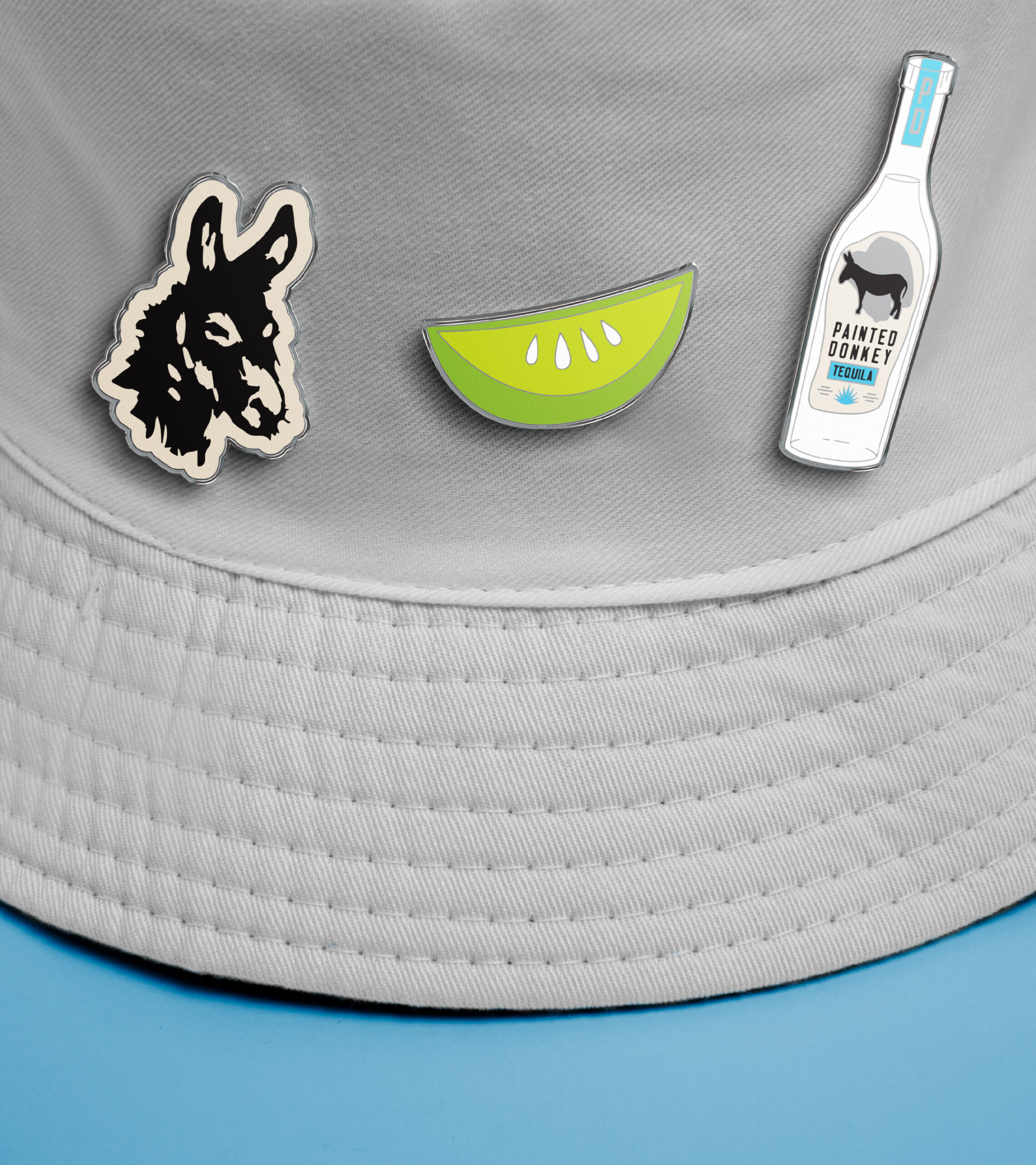 Painted donkey branded enamel pins